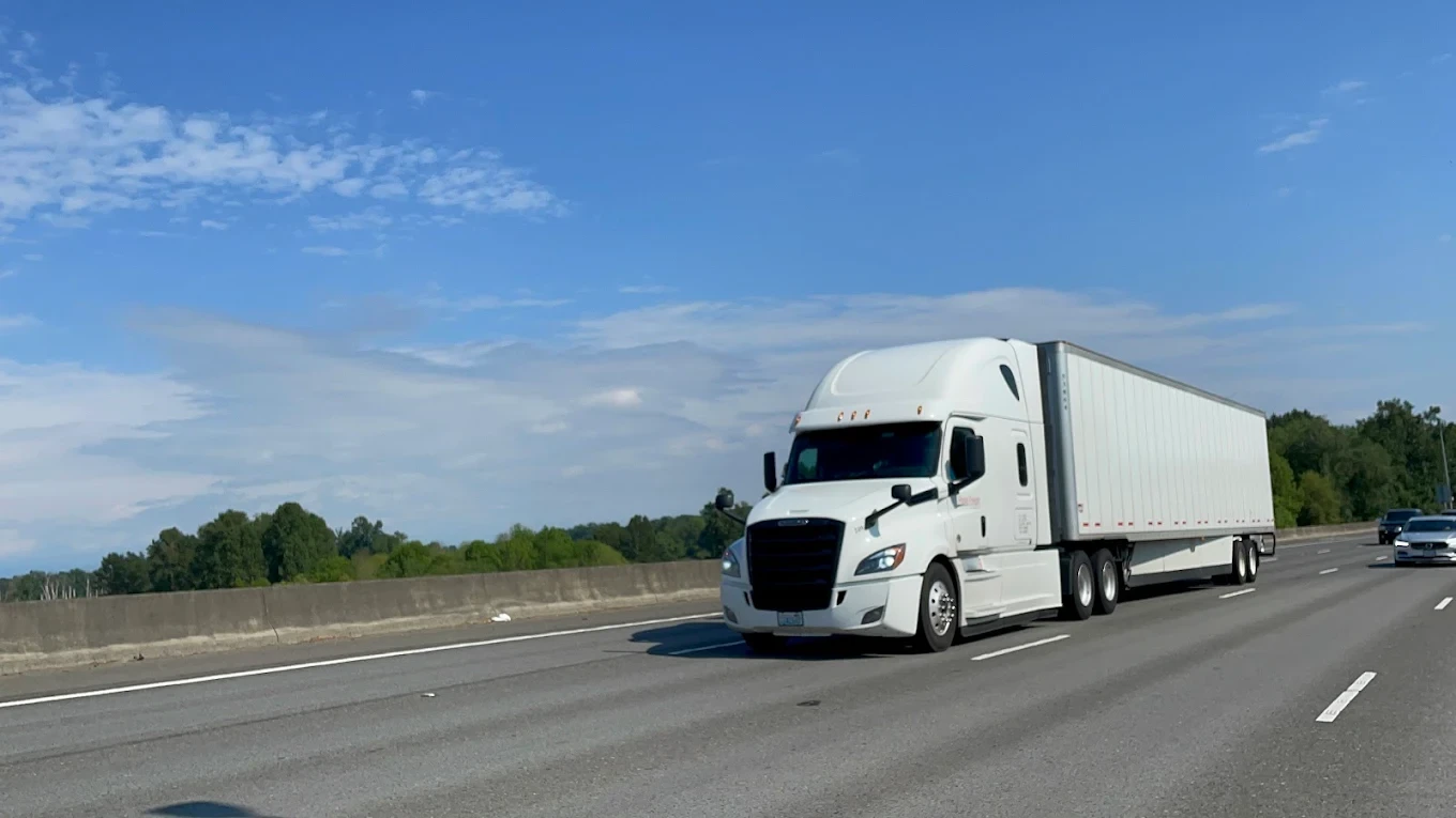 Rapid Freight white semi truck on highway